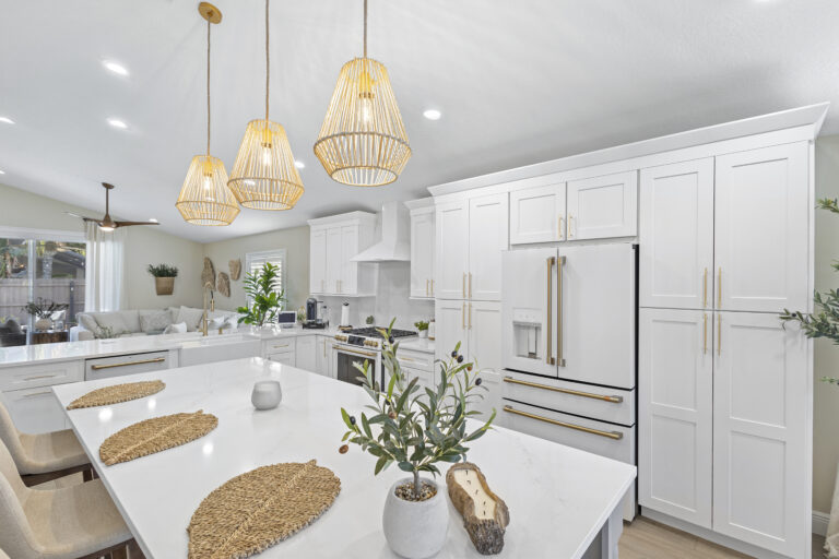White shaker cabinets with quartz countertops installed in a Lake Mary FL kitchen remodel by Complete Remodel LLC