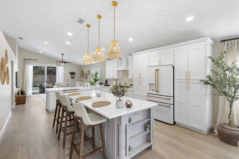White shaker cabinets with quartz countertops installed in a Lake Mary FL kitchen remodel by Complete Remodel LLC