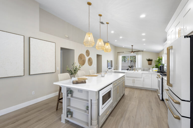 White shaker cabinets with quartz countertops installed in a Lake Mary FL kitchen remodel by Complete Remodel LLC