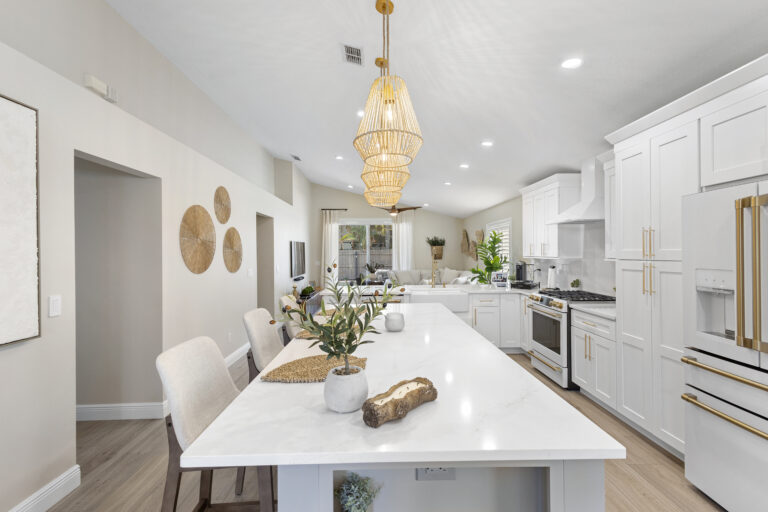 White shaker cabinets with quartz countertops installed in a Lake Mary FL kitchen remodel by Complete Remodel LLC