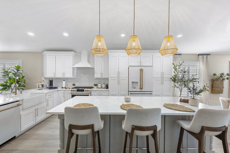 White shaker cabinets with quartz countertops installed in a Lake Mary FL kitchen remodel by Complete Remodel LLC
